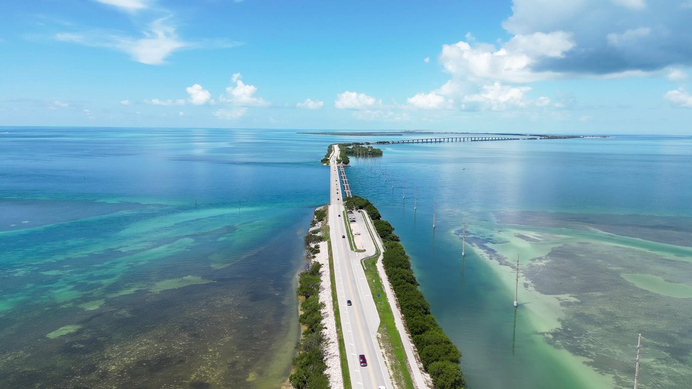Aerial view of a coastal highway crossing turquoise water on the Florida Gulf coast