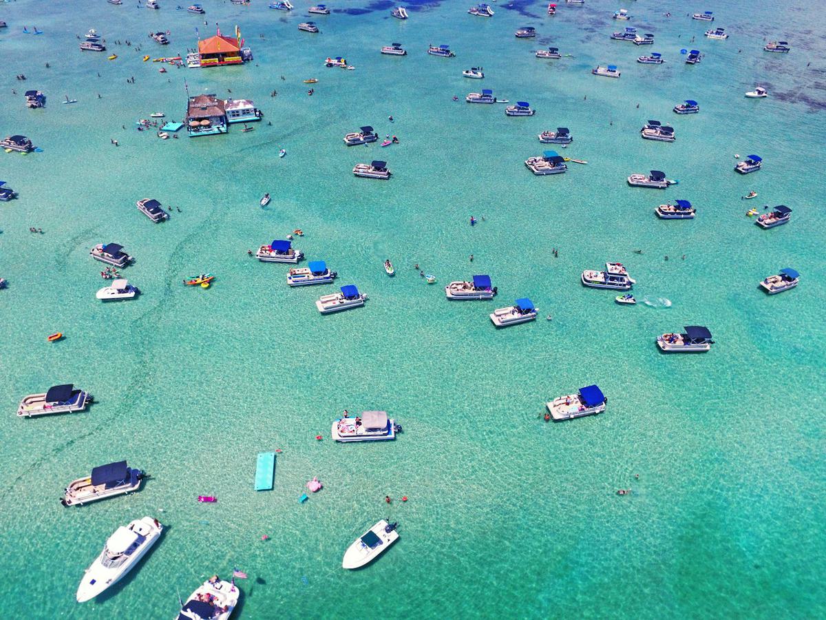 Boats anchored in the turquoise water off Destin, Florida